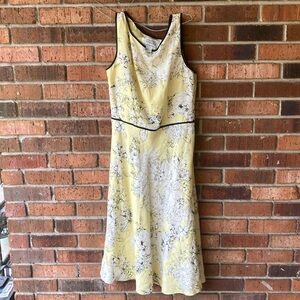 Yellow background dress with white flowers & black outline.✨